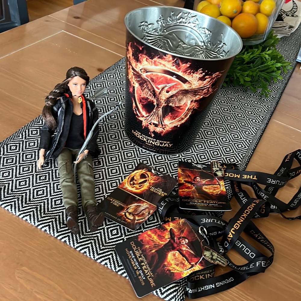 Katniss Everdeen action figure and memorabilia from opening night movies lot